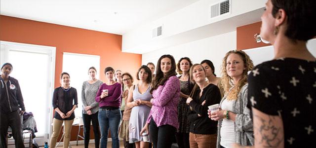 Nicole Sata (second from left) and Darcy Stanley (fourth from left) open a training session for prospective doulas (photos by Elisabeth Fall).