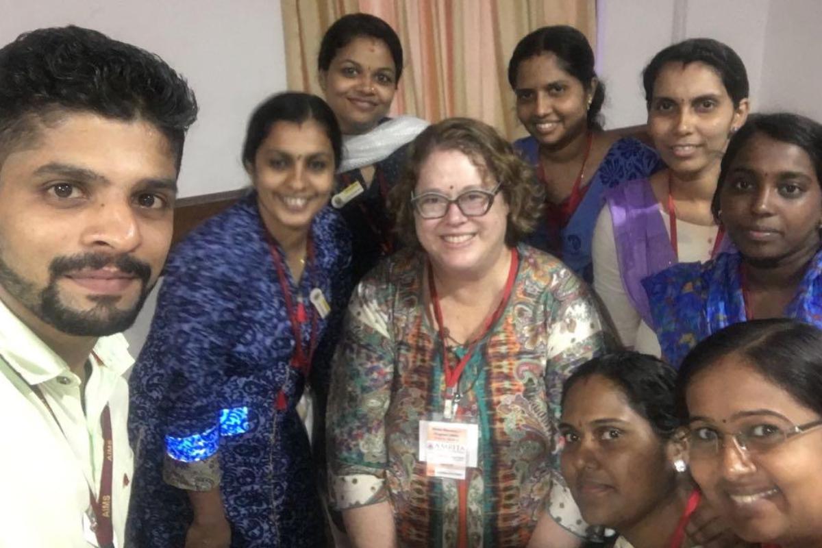 Sandra Staveski, PhD, CPNP-AC, FAAN, associate professor, (center) pictured with nurses from Amrita Hospitals in Kochi, India as they implement the Children’s HeartLink Nurse Residency Program in 2018 as an in-person program.