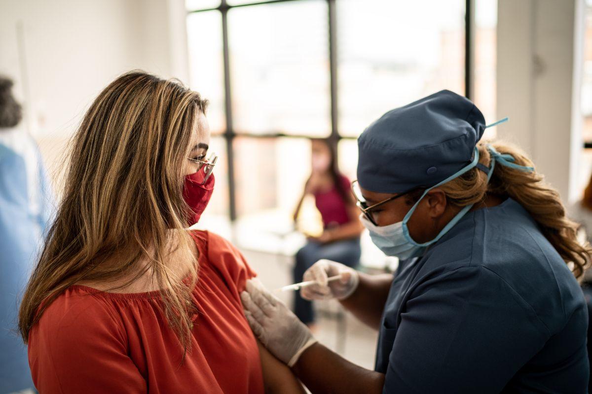 Patient receiving a vaccine from a health care provider