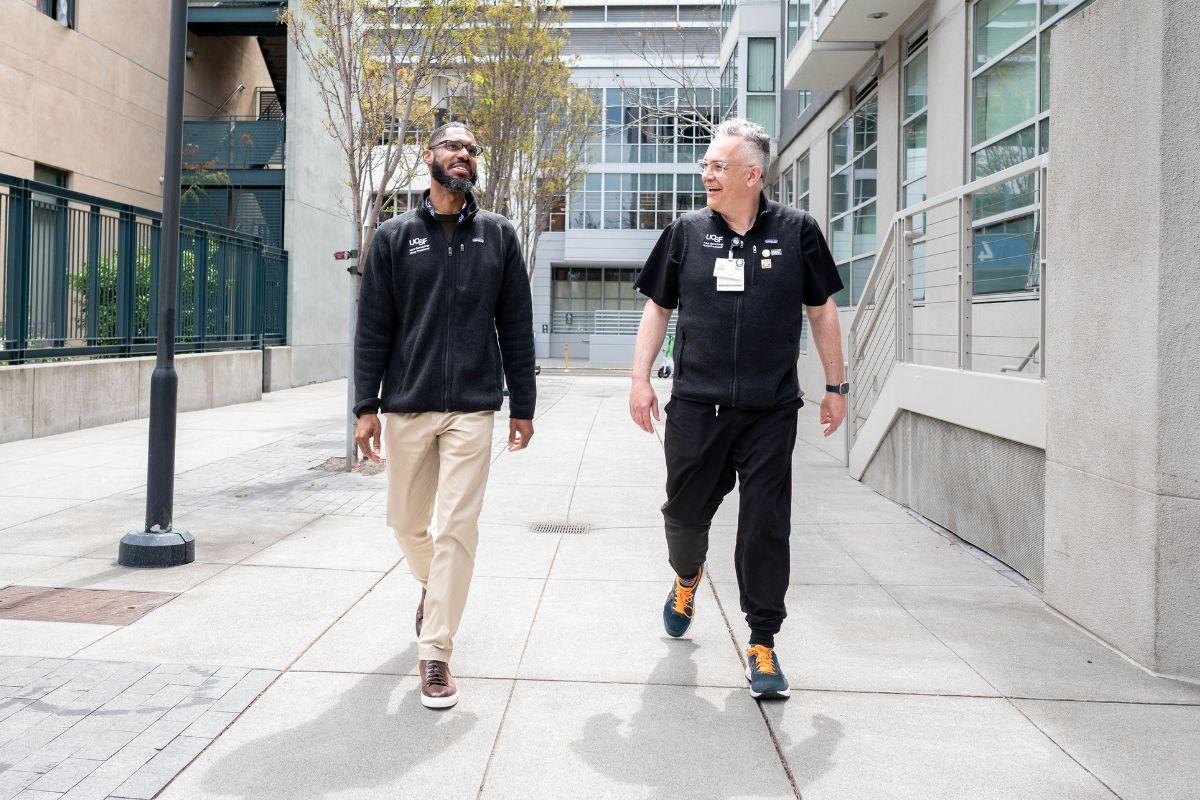 Jim Gatewood walks with student