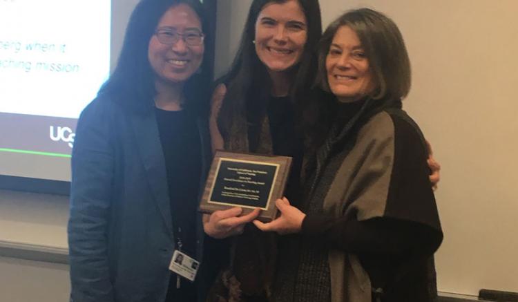 Rosalind De Lisser (center) is honored with the Overall Excellence in Teaching Award. Also pictured are Soo-Jeong Lee (left), chair of the Faculty Council, and Dean Catherine L. Gilliss.