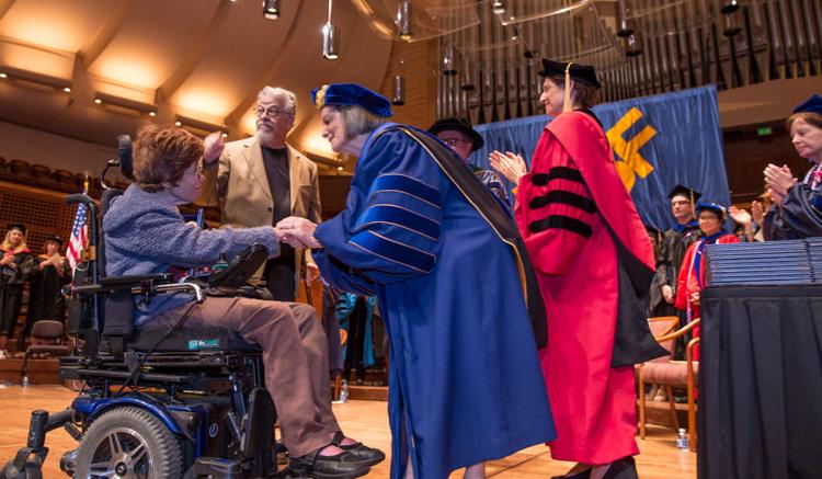 Mark and Andree Graham, parents of Emma Deboncoeur, accepted a posthumous degree on their daughter's behalf.