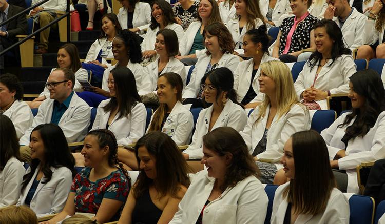 Students in the MEPN program mark the completion of their first year in the program at the Pinning Ceremony. (Photo credit: Arego Mitchell)