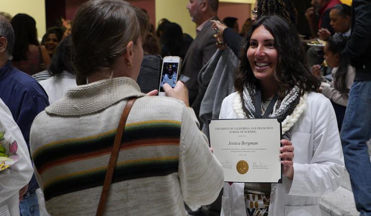 Student Jessica Bergman is pictured with the certificate she received at the Pinning Ceremony. (Photo credit: Arego Mitchell)
