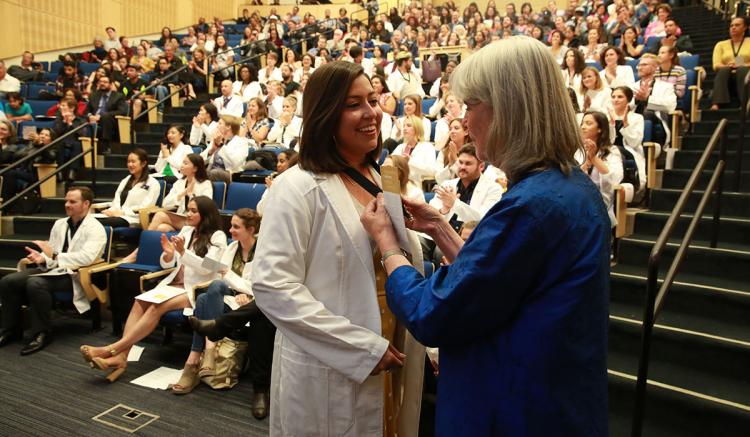 The White Coat Ceremony was held before hundreds of students' families and friends in Cole Hall.