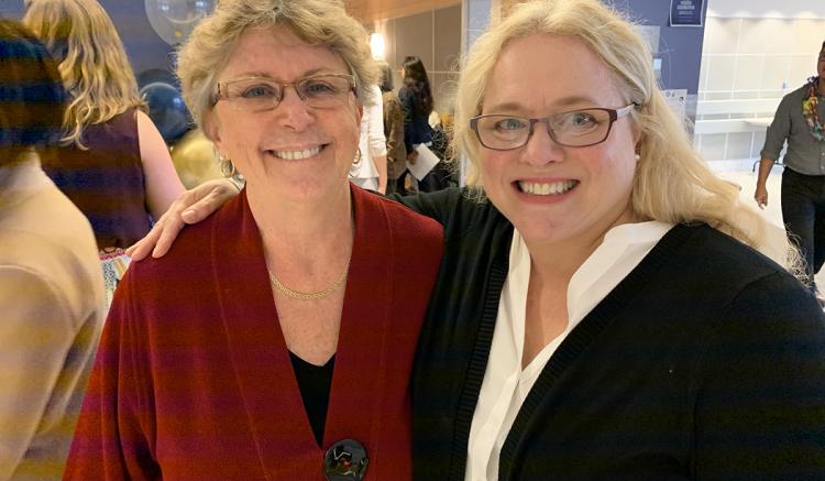 DNP Associate Director Annette Carley (left) with graduate Susan Diaz.