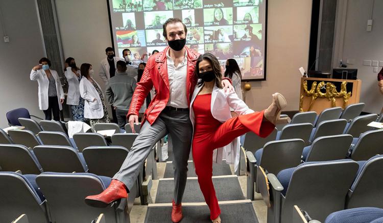 Students Coleton Schmitto (left) and Melissa Im-Giuffrida celebrate at the MEPN Pinning Ceremony.