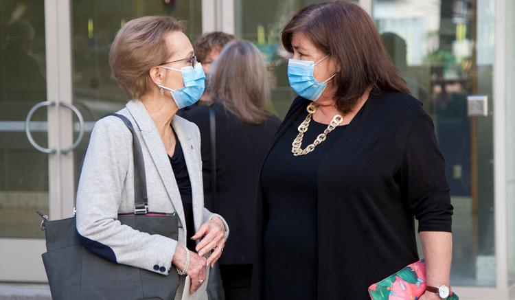 Sandra Weiss, professor, converses with Carol Dawson-Rose after the lecture.