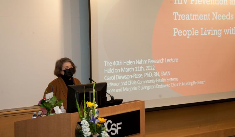 Dean Catherine Gilliss gives opening remarks at the 40th Helen Nahm Research Lecture, held March 11, 2022 on the Parnassus Heights campus. Dean Catherine Gilliss gives opening remarks at the 40th Helen Nahm Research Lecture, held March 11, 2022 on the Parnassus Heights campus.