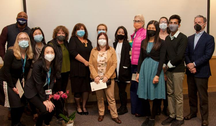 Faculty and staff gather for a group photo after the lecture on March 11, 2022.