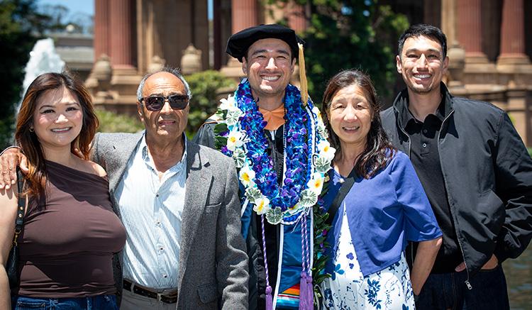 Samir Bisteni celebrates with loved ones at the 2026 UCSF School of Nursing commencement ceremony at the Palace of Fine Arts. 
