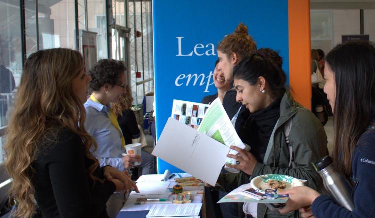 Students networking with Natasha Kubek from Central Valley Health Network and Patricia Caplan from Mission Neighborhood Health C