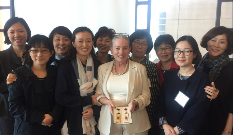 Professor Fleming (center) and group pose.