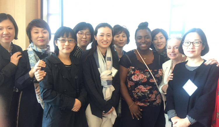 Organizer and leader from UCSF School of Nursing Teashall Britton and Professor Fleming (center right) pose with new friends.