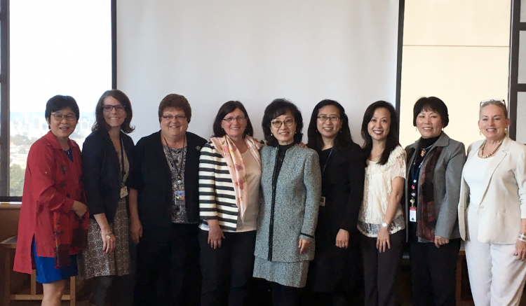 Group photo of several UCSF faculty, SFVAMC leadership, and Monica Kown (center).