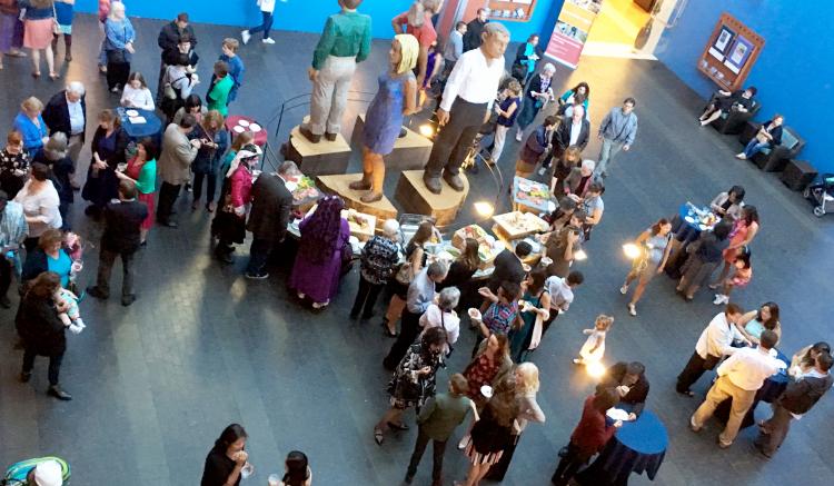 Friends and family gather in the Fischer Auditorium of the UCSF Mission Bay Conference Center for a MEPN reception prior to the 