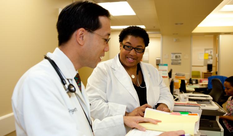 Family nurse practitioner Erica Bagby confers with physician Gregory Wong at San Francisco’s South of Market Health Center