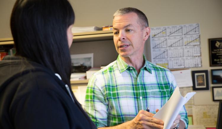 Clinical Professor Matt Tierney speaks with a student