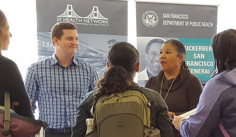 Daniel Giddings and Tina Hinnant draws a crowd discussing opportunities at San Francisco Department of Public Health, including