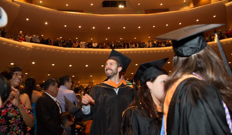 students wait in the audience