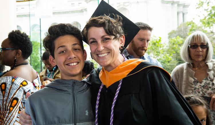 student with family pose