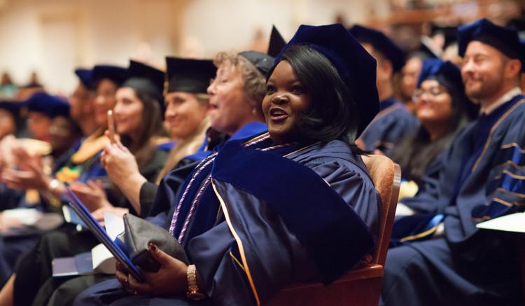 student graduates in audience
