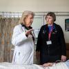 Michele Pelter, PhD, RN, speaks to Kirsten Fleischmann, MD, MPH, and a patient from a hospital room in the cardiac ICU. 