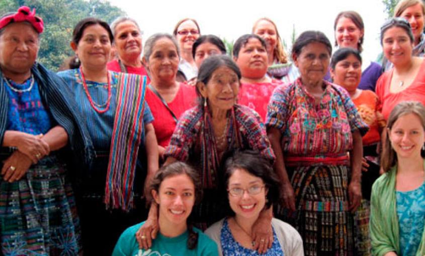 Jenna Shaw-Battista (bottom center, wearing glasses) with colleagues and local midwives in Guatemala