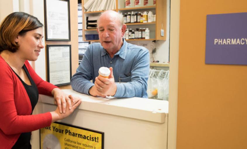 Psychiatric/mental health nurse practitioner Jamie Sanders consults with pharmacist Lester Bornheim at Marin Community Clinics (photo by Elisabeth Fall).