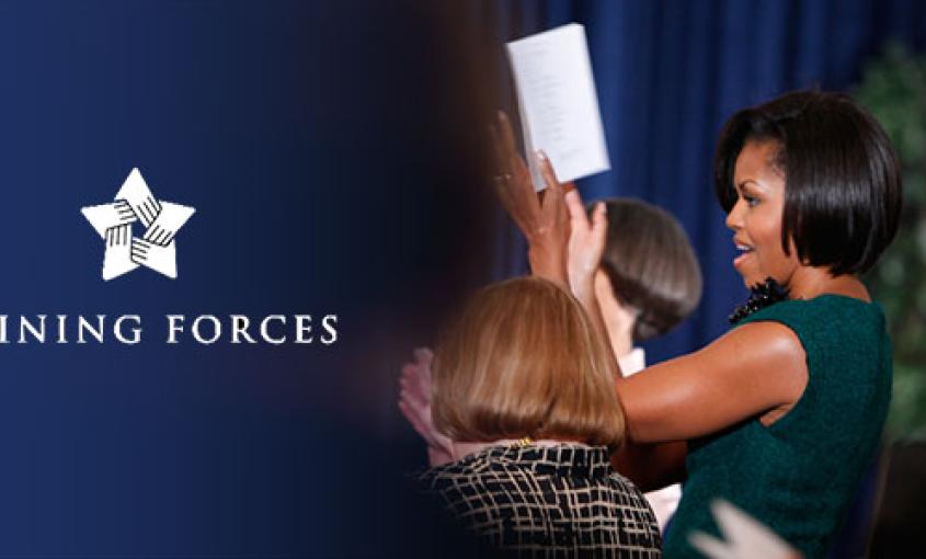 First Lady Michelle Obama cheers while attending a Joining Forces event.