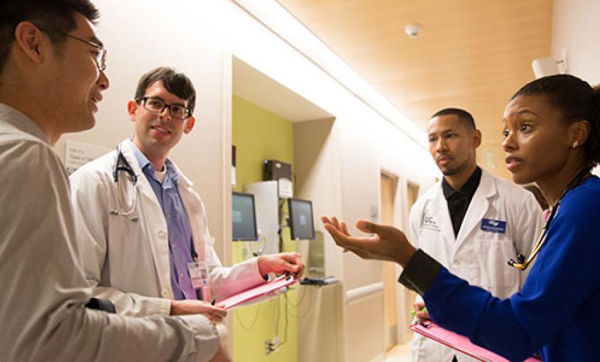 From left: UCSF dental student Brian P. Lee, medical student Noah Younger, pharmacy student Jason Kirkwood and nursing student Brianna Vixama participate in an interprofessional standardized patient exercise (photo by Elisabeth Fall).