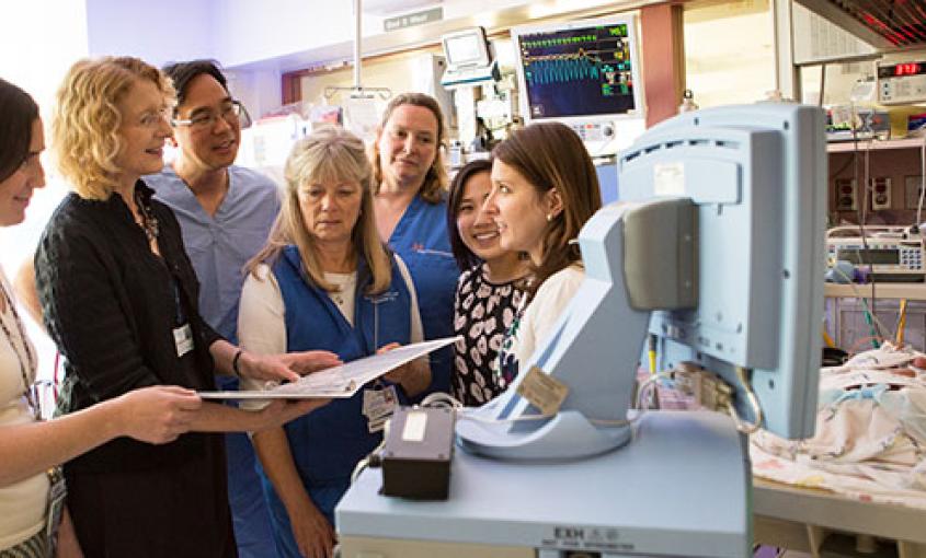 Interdisciplinary team members in the intensive care nursery. From left to right: pediatric pharmacist Sarah Scarpace Lucas, School of Nursing faculty member Linda Franck, neonatologist Thomas Shimotake, clinical nurse specialist Linda Lefrak, nurse Robin Bisgaard, research assistant Fiona Ng and pediatric pharmacy resident Sylvia Stoffella (photos by Elisabeth Fall).