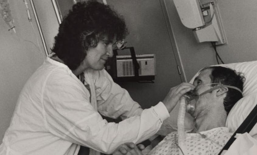 Diane Jones treats an early AIDS patient at San Francisco General in 1984 (photo by Gypsy Ray).