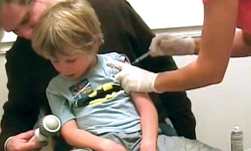 Child receives an immunization. 