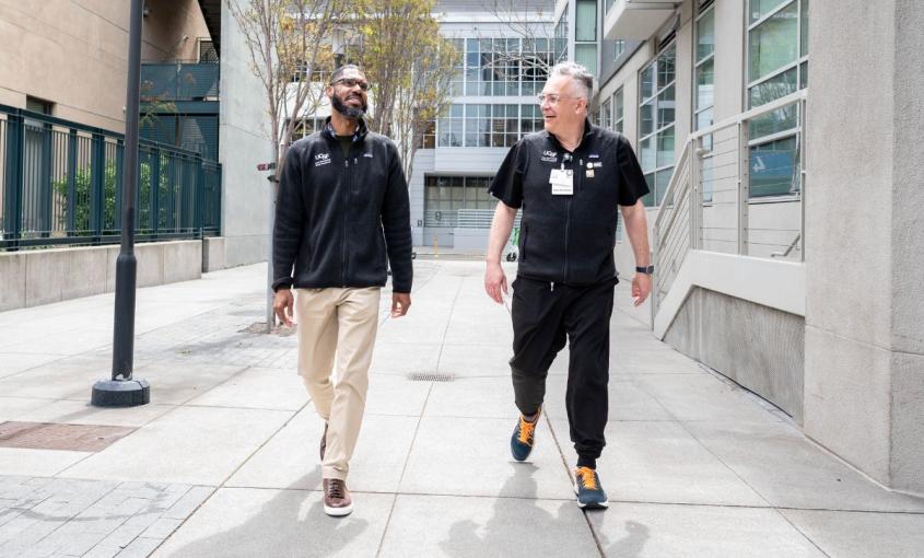 Jim Gatewood walks with student