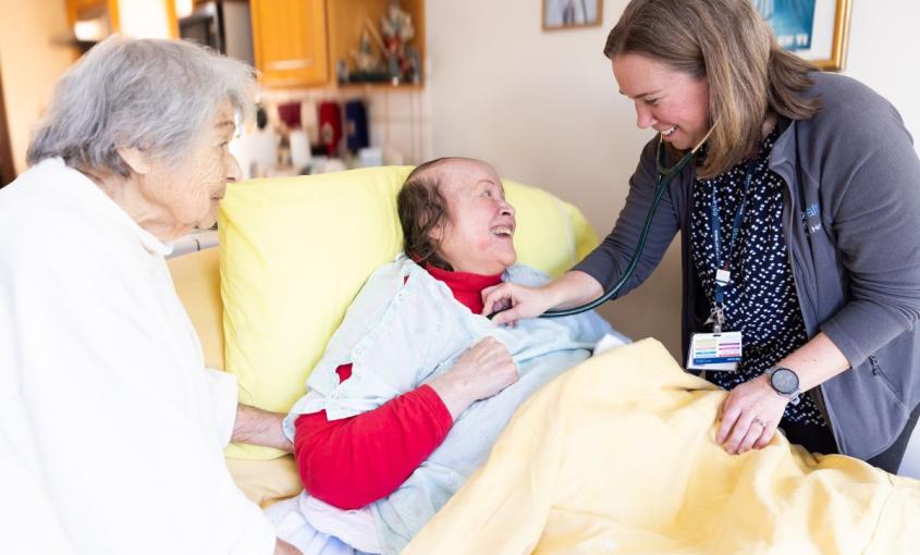 Courtney Gordon, DNP, NP (far right), delivers home-based care to patients.