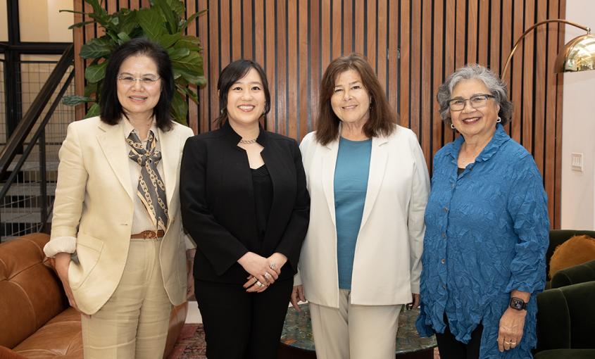 Jian Zhang, Jarmin Yeh, Carol Dawson-Rose, and Jennie Chin Hansen stand together in a lounge.