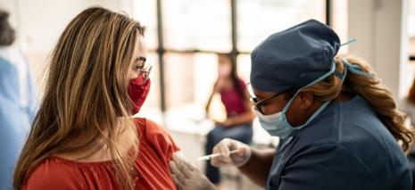 Patient receiving a vaccine from a health care provider