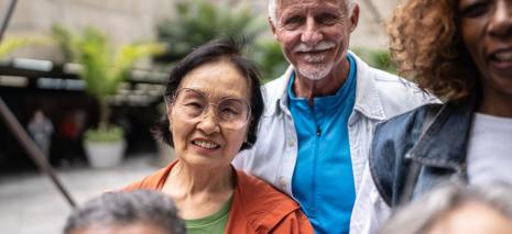 Five adults standing outside
