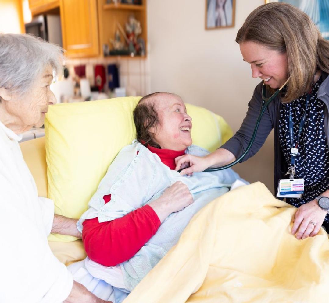 Courtney Gordon, DNP, NP (far right), delivers home-based care to patients.