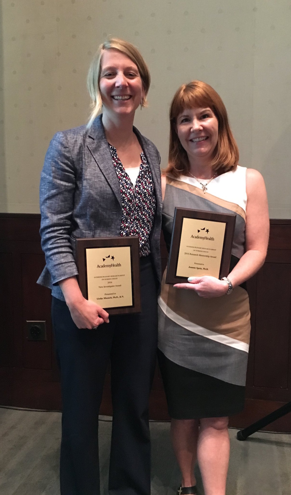 Ulrike Muench, RN, PhD, and Joanne Spetz, PhD, pose with their awards at the AHIRGNI Conference